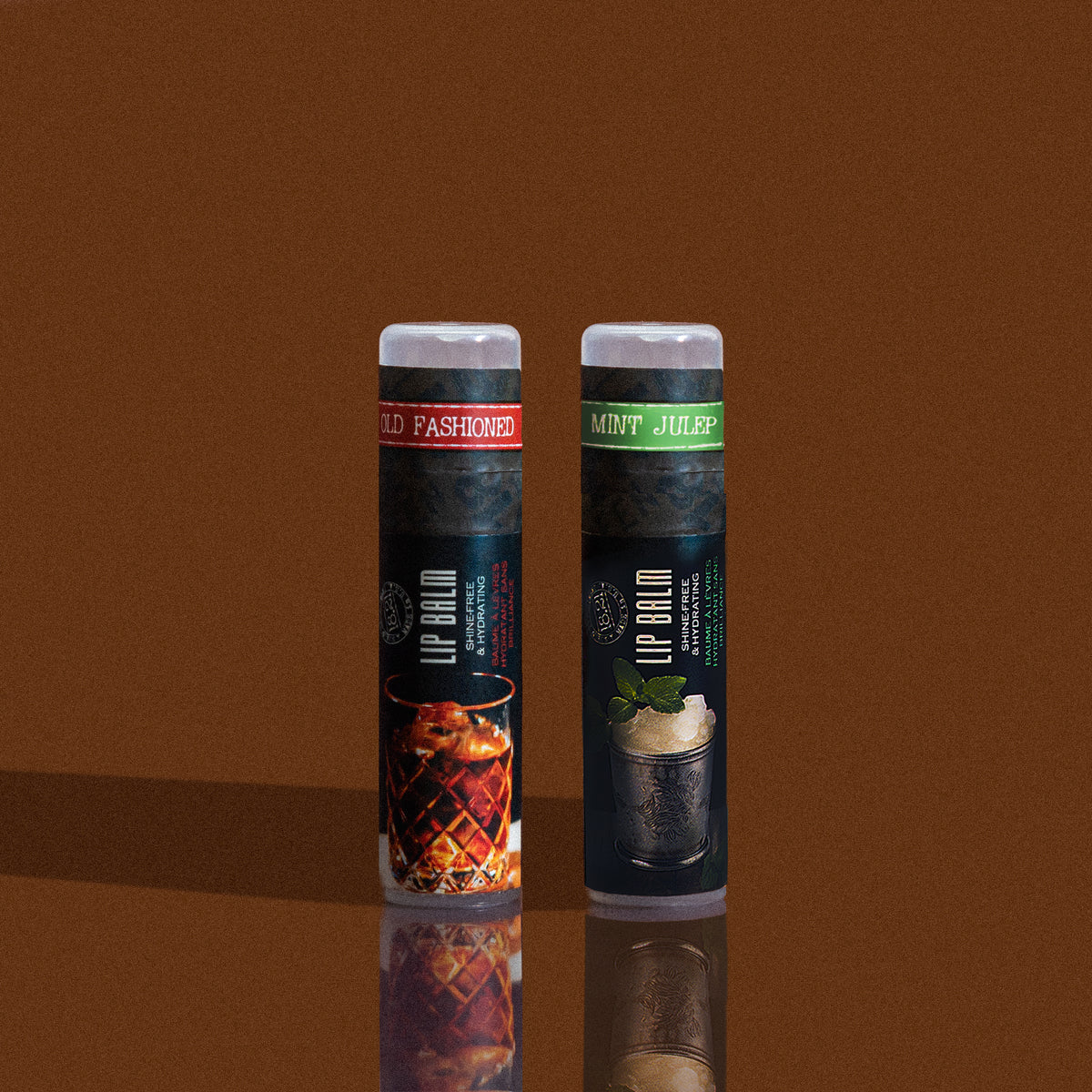 Two lip balm tubes on a reflective brown surface with a brown background