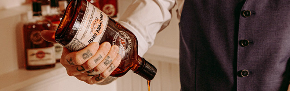 18.21 Man Made 18oz Wash Noble Oud pouring out of bottle