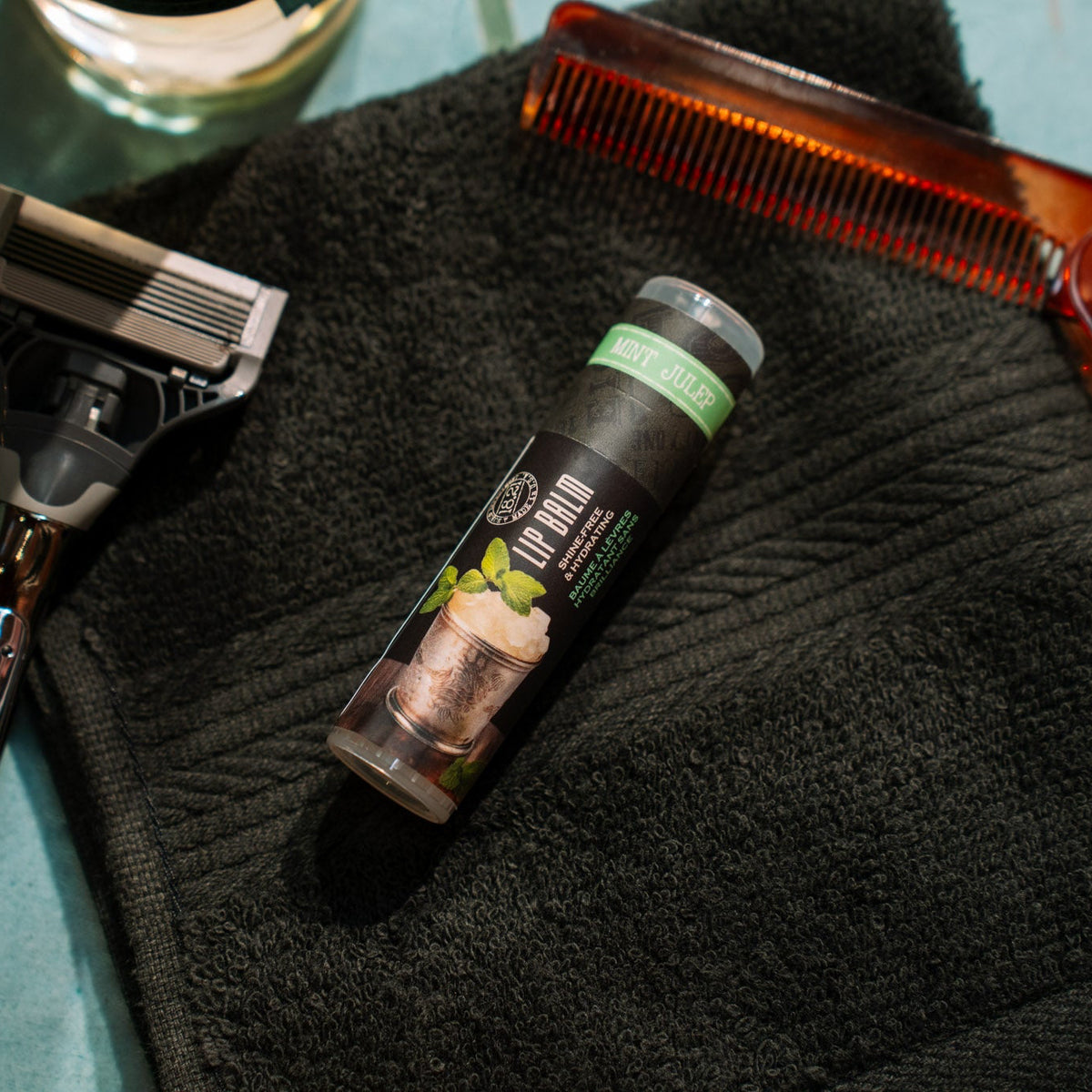 mint julep lip balm next to shaver and barber comb